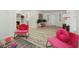 Spacious living room with hardwood floors, contemporary decor, a decorative fireplace and ample natural light at 559 Scotland St, Dunedin, FL 34698