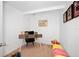 Small office with a simple desk, chair, and natural light at 559 Scotland St, Dunedin, FL 34698