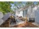 Cozy patio featuring outdoor seating, a stylish rug, and convenient access to the house through double doors at 559 Scotland St, Dunedin, FL 34698