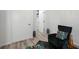 Sitting area with black accent chair and colorful decorative pillow at 559 Scotland St, Dunedin, FL 34698