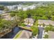 Aerial view of the townhome community surrounded by beautiful ponds and mature trees at 5619 Tranquil Pond Pl, Riverview, FL 33578