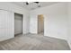 Bright bedroom with sliding closet doors and carpet at 5619 Tranquil Pond Pl, Riverview, FL 33578