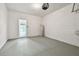 Clean garage space features epoxy flooring and a water heater at 5619 Tranquil Pond Pl, Riverview, FL 33578