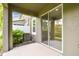 This covered patio has views of the pond, AC unit, and backyard at 5619 Tranquil Pond Pl, Riverview, FL 33578
