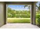 A picturesque pond is framed by the covered patio, offering a serene outdoor space at 5619 Tranquil Pond Pl, Riverview, FL 33578