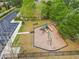 Aerial view of a well-maintained community playground with slides, swings, and climbing structures for enjoyment at 5619 Tranquil Pond Pl, Riverview, FL 33578