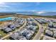 Aerial showing a luxury residential community with stunning coastal views and a lagoon pool at 6023 Cat Claw Ln, Bradenton, FL 34210