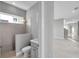 Bathroom with tiled walk-in shower, modern fixtures, and view to the outside at 6023 Cat Claw Ln, Bradenton, FL 34210