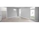 Bright bedroom with tile floors and plenty of natural light from the modern windows at 6023 Cat Claw Ln, Bradenton, FL 34210