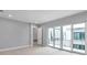 Spacious bedroom with tile flooring, neutral paint, and direct access to the balcony through sliding glass doors at 6023 Cat Claw Ln, Bradenton, FL 34210