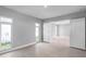 Bedroom with tile floors and modern windows and french doors to another room at 6023 Cat Claw Ln, Bradenton, FL 34210