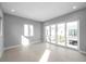 Bright bedroom featuring large windows, neutral color scheme, and tile floor at 6023 Cat Claw Ln, Bradenton, FL 34210