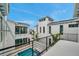An exterior view of the property highlighting the pool and contemporary architecture at 6023 Cat Claw Ln, Bradenton, FL 34210