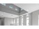 Bright hallway with multiple windows providing ample natural light and recessed lighting illuminating the space at 6023 Cat Claw Ln, Bradenton, FL 34210