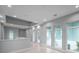 Bright hallway with multiple windows providing ample natural light and recessed lighting illuminating the space at 6023 Cat Claw Ln, Bradenton, FL 34210