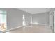Bright, light-filled living room with tiled floors and neutral color scheme at 6023 Cat Claw Ln, Bradenton, FL 34210