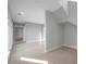 Spacious living room featuring neutral walls, modern tile floors and plenty of natural light at 6023 Cat Claw Ln, Bradenton, FL 34210