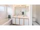Bathroom featuring double sinks, tiled shower and tub combo at 6236 Olivedale Dr, Riverview, FL 33578