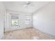 Bedroom with two windows and a ceiling fan at 6236 Olivedale Dr, Riverview, FL 33578
