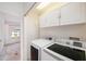 A small laundry room featuring a new washer and dryer at 6236 Olivedale Dr, Riverview, FL 33578