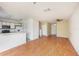Open-concept living and kitchen area features laminate floors at 6236 Olivedale Dr, Riverview, FL 33578