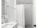 Bathroom featuring a shower over tub with white marble tile at 6248 Tabogi Trl, Wesley Chapel, FL 33545