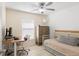 Bedroom with neutral paint, a ceiling fan, and tile floors at 6248 Tabogi Trl, Wesley Chapel, FL 33545