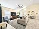 Inviting living room featuring a large window and neutral-toned decor at 6248 Tabogi Trl, Wesley Chapel, FL 33545