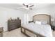 Main bedroom features neutral paint, ceiling fan, and tile floors at 6248 Tabogi Trl, Wesley Chapel, FL 33545