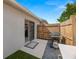 Back patio area with sliding glass doors at 6248 Tabogi Trl, Wesley Chapel, FL 33545