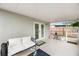 Outdoor covered patio boasts tile floor, neutral paint, and comfortable seating space at 6248 Tabogi Trl, Wesley Chapel, FL 33545