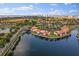Aerial view of Lakeside Villas featuring waterfront views, landscaping, and tile roofs at 6277 Bahia Del Mar Blvd # 110, St Petersburg, FL 33715
