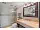 Beautiful bathroom featuring a tile shower with frameless glass and a light marble countertop at 6277 Bahia Del Mar Blvd # 110, St Petersburg, FL 33715