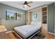 Well lit bedroom with a murphy bed, built-in shelving, and a view to the outside at 6277 Bahia Del Mar Blvd # 110, St Petersburg, FL 33715