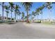 Scenic community entrance with palm trees and pristine landscaping at 6277 Bahia Del Mar Blvd # 110, St Petersburg, FL 33715