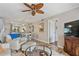 Cozy living area with tile flooring, ceiling fan, and a view into the kitchen at 6277 Bahia Del Mar Blvd # 110, St Petersburg, FL 33715
