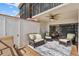 Outdoor patio with ample seating, ceiling fan and a view of the landscaping at 6277 Bahia Del Mar Blvd # 110, St Petersburg, FL 33715