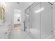 Bathroom featuring glass shower, stylish tilework and floors, and double sink vanity at 803 W Woodlawn Ave, Tampa, FL 33603