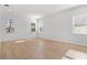 Well-lit bedroom with three windows and light hardwood flooring at 803 W Woodlawn Ave, Tampa, FL 33603