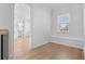 Inviting bedroom with hardwood floors, a window seat and an attached bathroom at 803 W Woodlawn Ave, Tampa, FL 33603