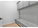 Mudroom with gray cabinets, drawers and bench seating at 803 W Woodlawn Ave, Tampa, FL 33603
