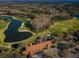 Aerial view of the golf course and club house showcasing its scenic location and architectural details at 9481 Highland Oak Dr # 1616, Tampa, FL 33647