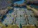 Aerial view of the tennis court complex showcasing the well-maintained courts and beautiful landscaping at 9481 Highland Oak Dr # 1616, Tampa, FL 33647