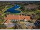Aerial view of the golf course and club house showcasing its scenic location and architectural details at 9481 Highland Oak Dr # 1616, Tampa, FL 33647