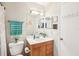 Bathroom featuring a wood vanity, a bright mirror, and clean white fixtures at 9481 Highland Oak Dr # 1616, Tampa, FL 33647