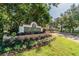 Elegant community sign surrounded by landscaping and flowers, welcoming residents and visitors alike at 9481 Highland Oak Dr # 1616, Tampa, FL 33647