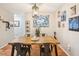 Cozy dining room featuring a wooden table, modern light fixture, and decorative wall art at 9481 Highland Oak Dr # 1616, Tampa, FL 33647