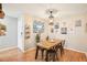 Bright dining room featuring a wooden table, stylish lighting, and modern decor at 9481 Highland Oak Dr # 1616, Tampa, FL 33647