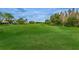 Expansive green golf course with meticulously maintained turf, bordered by mature trees at 9481 Highland Oak Dr # 1616, Tampa, FL 33647