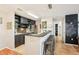 Open-concept kitchen with a bar area, seating, and views into other living spaces at 9481 Highland Oak Dr # 1616, Tampa, FL 33647